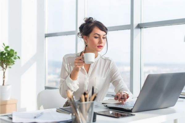 Malaysian HR professional checking legal compliance papers
