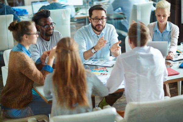 HR consultants and executives discussing strategic plans in a conference room.
