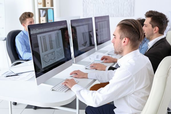 Tech professionals working on cybersecurity systems.
