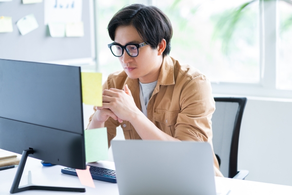 Employee reviewing HRDF claim forms for accuracy.
