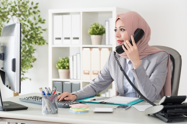 HR manager reviewing HRD Corp employer eligibility requirements.
